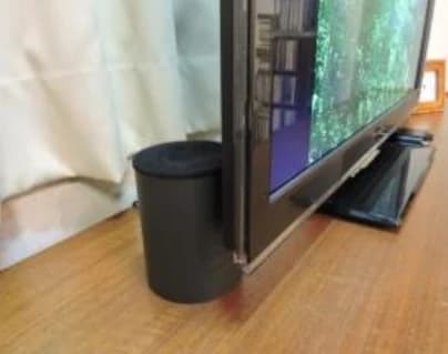 Speakers placed behind the television